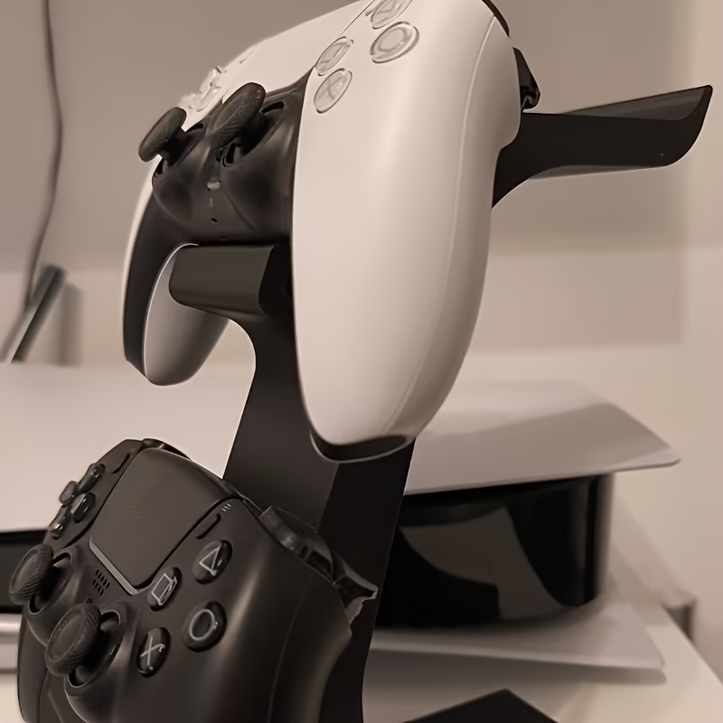black 3-in-1 PS5 and Xbox Controller Stand – Compatible with PlayStation 5/Xbox Consoles. A gaming desktop organizer with a headphone hanger, non-charging base that holds 2 controllers and headphones. Space-saving white/black console accessory. - Image 1