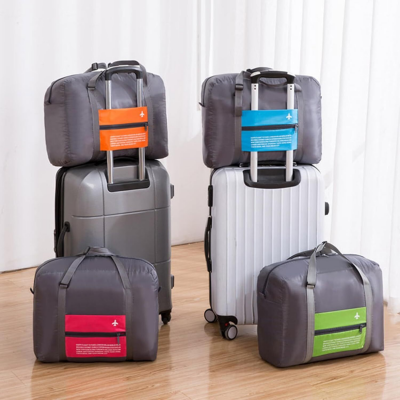 4-Pack Foldable Travel Duffel Bag Set – Compact Carry-On Luggage in Pink, Blue, Green & Orange | Perfect for Family Trips, Gifts & Organized Travel - Image 8
