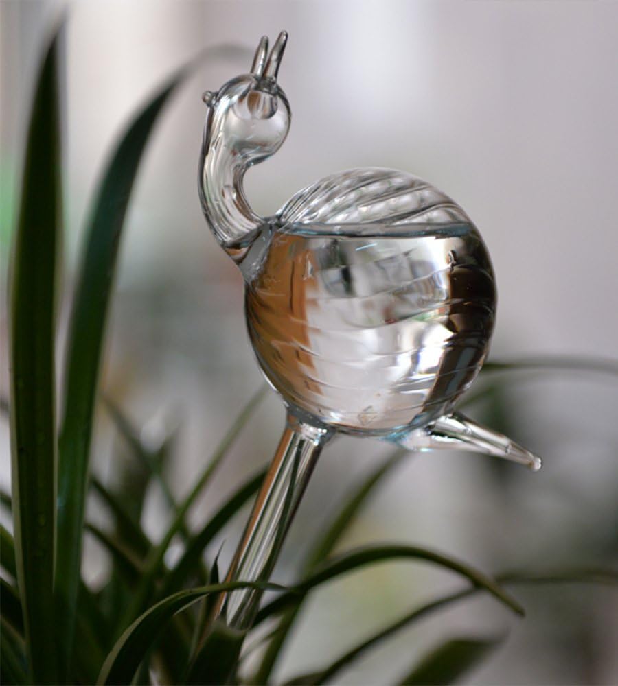snail-shaped hand-blown clear glass self-watering sustainable mini transparent plant watering pot - Image 1
