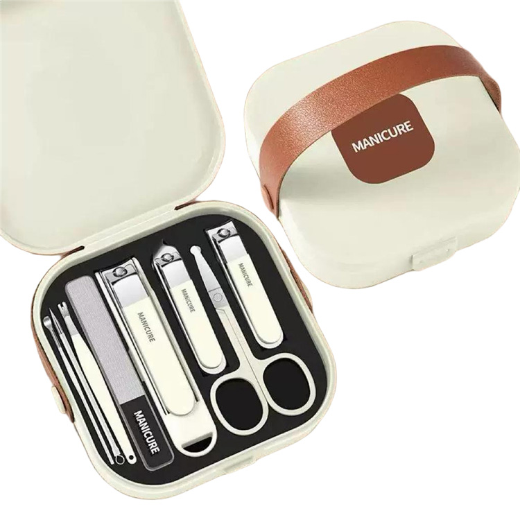 Manicure set - Pedicure set - Nail clippers - Nail scissors - Nail file - Tweezers - Stainless steel - Luxury case - Travel size - Nail cutting - Cuticle pusher - Nail styling - Hands and feet - Compact - Beige - 7 pieces - Image 1