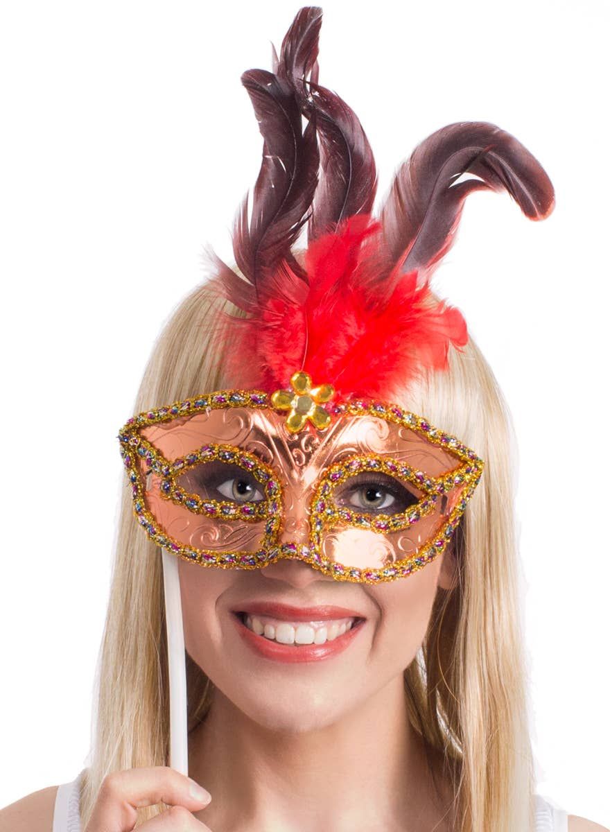 Handheld Red Feather Gold Masquerade Mask - Image 1