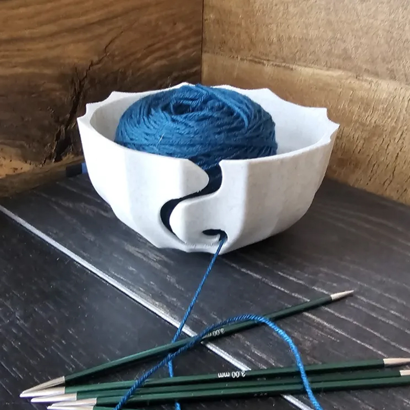 A 3D-printed yarn bowl to accompany your knitting and crochet time. White. - Image 1