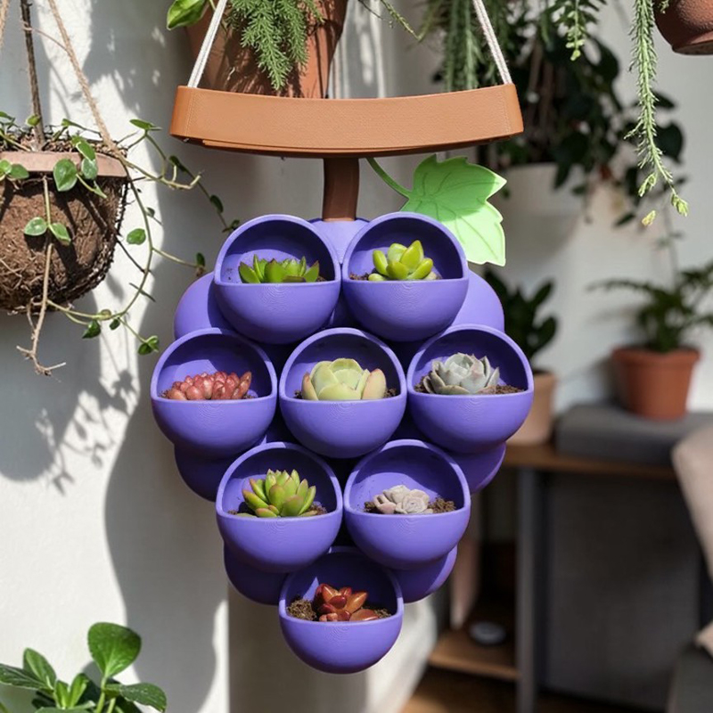 3D-printed grape pots in purple, brown, and green. - Image 1