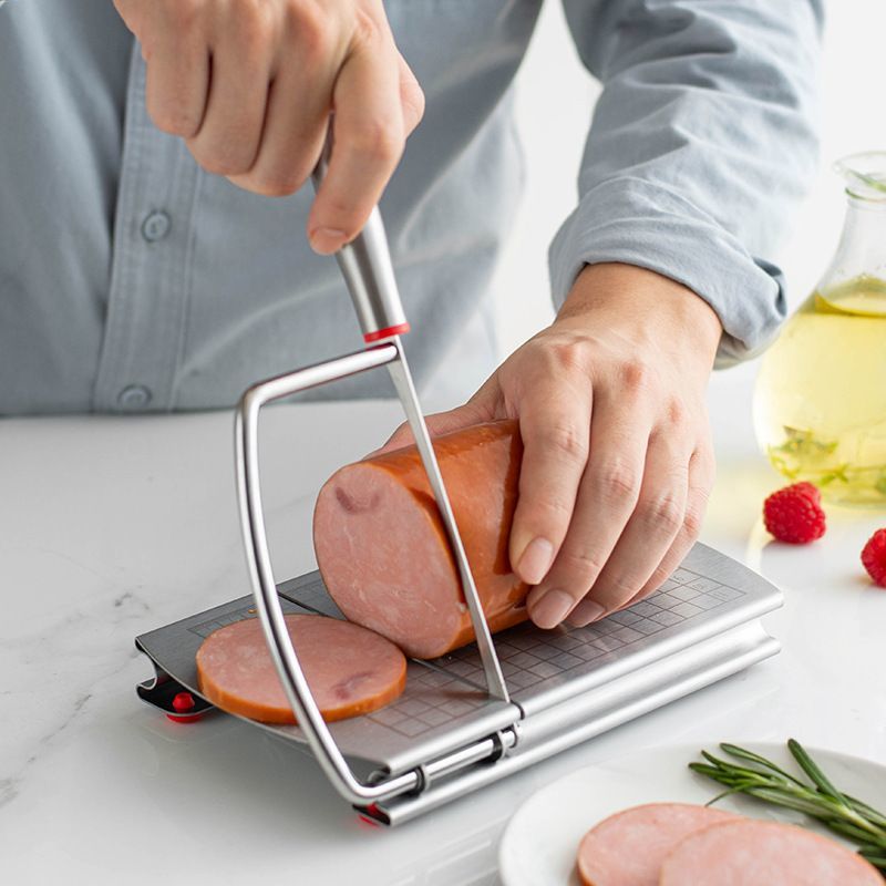 A stainless steel cheese slicer with scales-With scale - Image 1