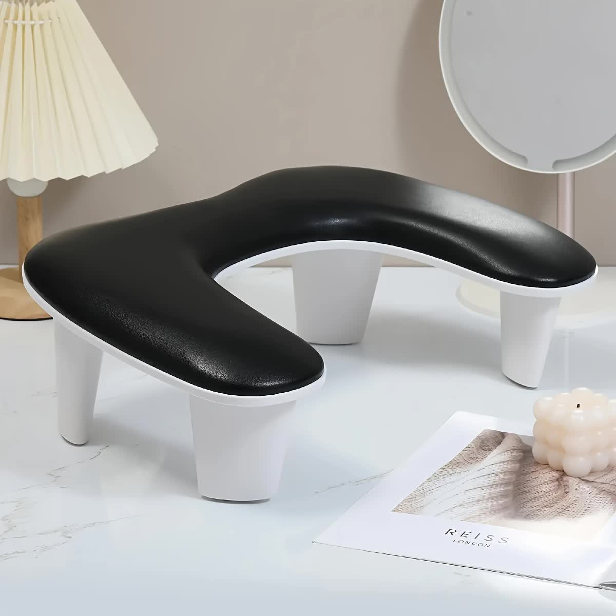 BLACK This handheld nail care device integrates a U-shaped pillow and comes with a portable detachable stand. Designed with an inclined PU material and a sturdy base, it is crafted for both comfort and portability. - Image 5