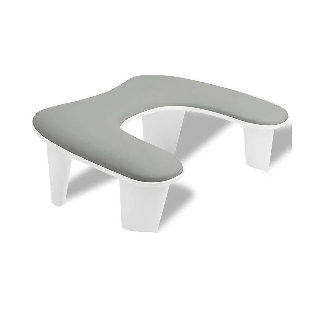 Grey This handheld nail care device integrates a U-shaped pillow and comes with a portable detachable stand. Designed with an inclined PU material and a sturdy base, it is crafted for both comfort and portability. - Image 1
