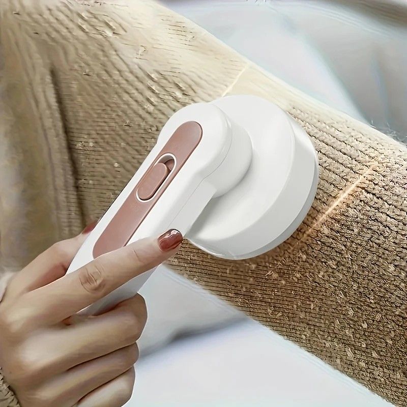 Efficient Lint Remover, multi-functional, powerful lint removal, safe and portable, rejuvenates clothing effortlessly. - Image 1