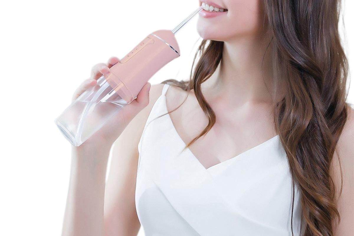Cordless Portable Electric Water Flosser Teeth Cleaner Floss Irrigator With 4 Jet Tips - Pink - Image 4