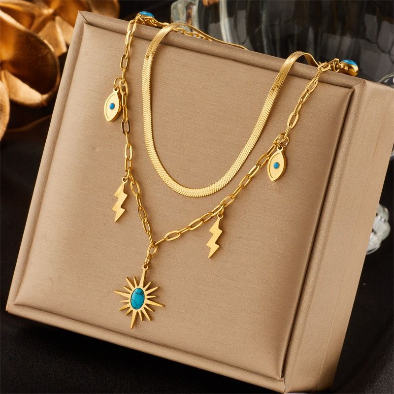Double-layered bohemian-style necklace, 18K gold-plated titanium choker with eye and lightning bolt pendants - Image 1