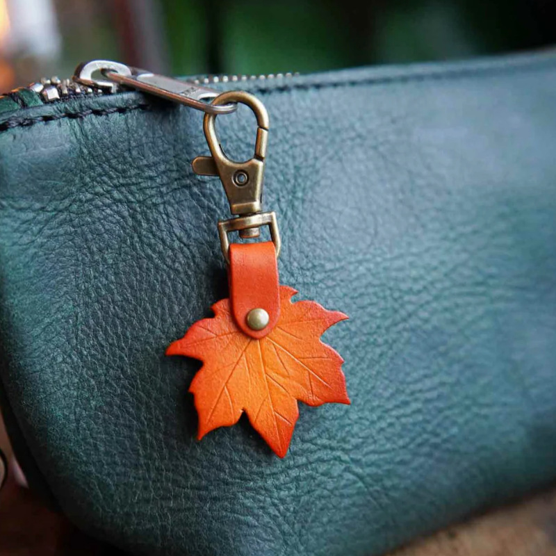 Orange 3 Pack PU Leather Maple Leaf Keychain Set Vintage Style Autumn Leaf Keyring Bag Charm Pendant for Women Handbag and Car Keys - Image 1