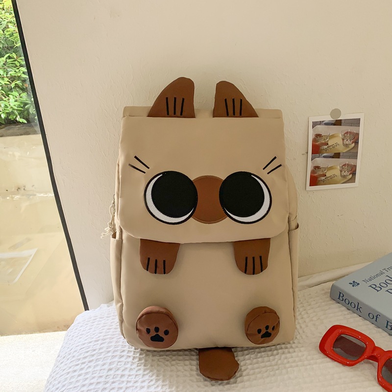 Khaki Lightweight Nylon Waterproof Schoolbag for Children - Large Capacity Daypack with Ugly-Cute Cat Design - Image 1