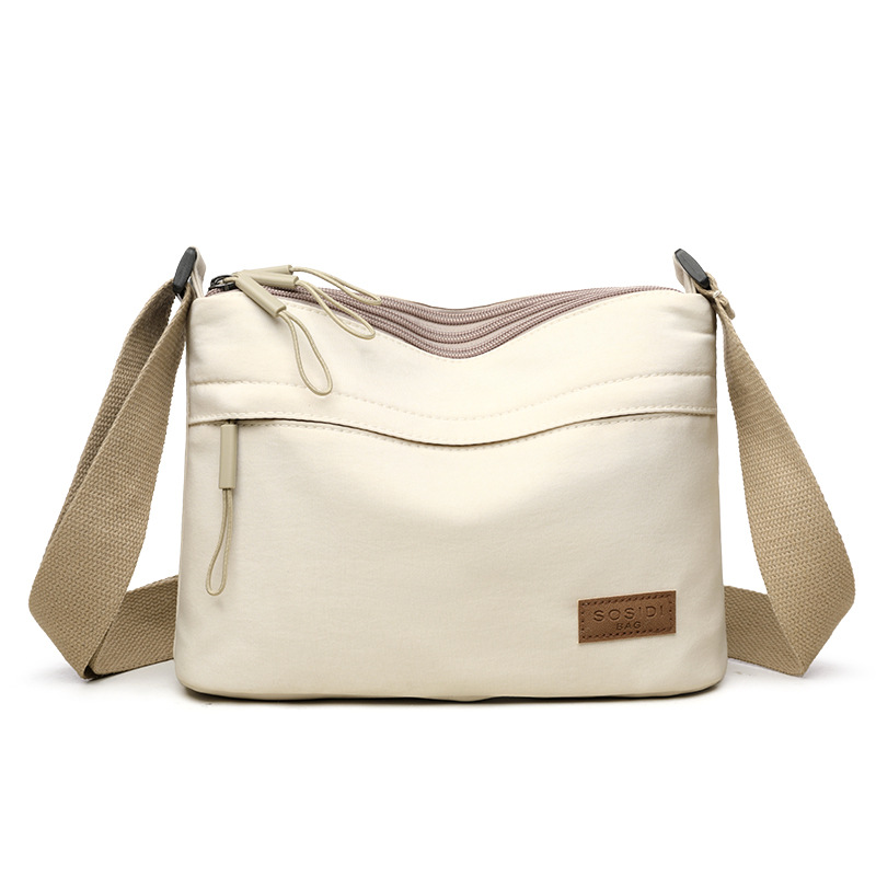 White Women Lightweight Nylon Crossbody Bag with Multiple Pockets Compact Shoulder Bag for Travel and Daily Essentials in Australia - Image 1