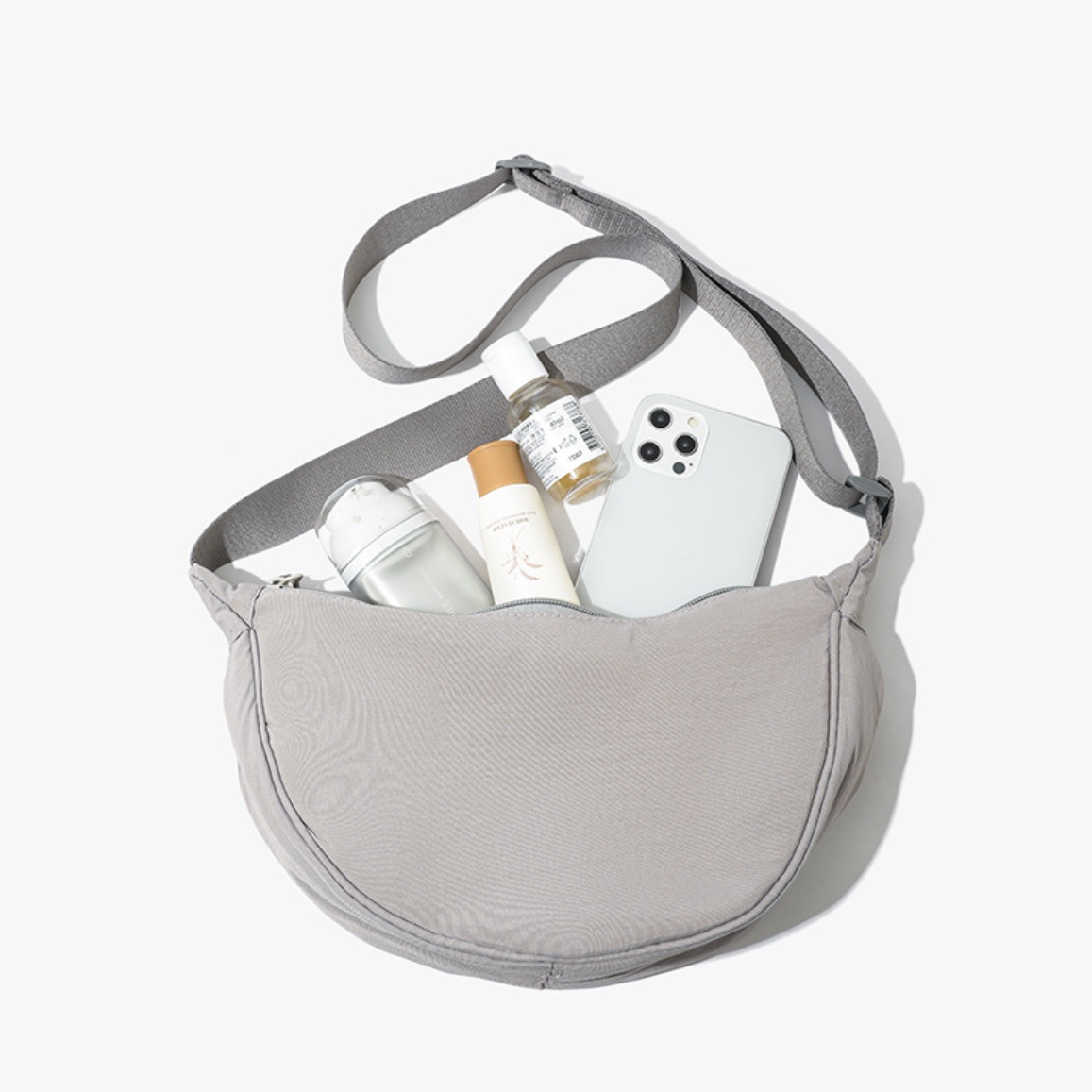Grey Lightweight Nylon Crossbody Bag – Compact Saddle Style with Adjustable Strap for Everyday Use - Image 1