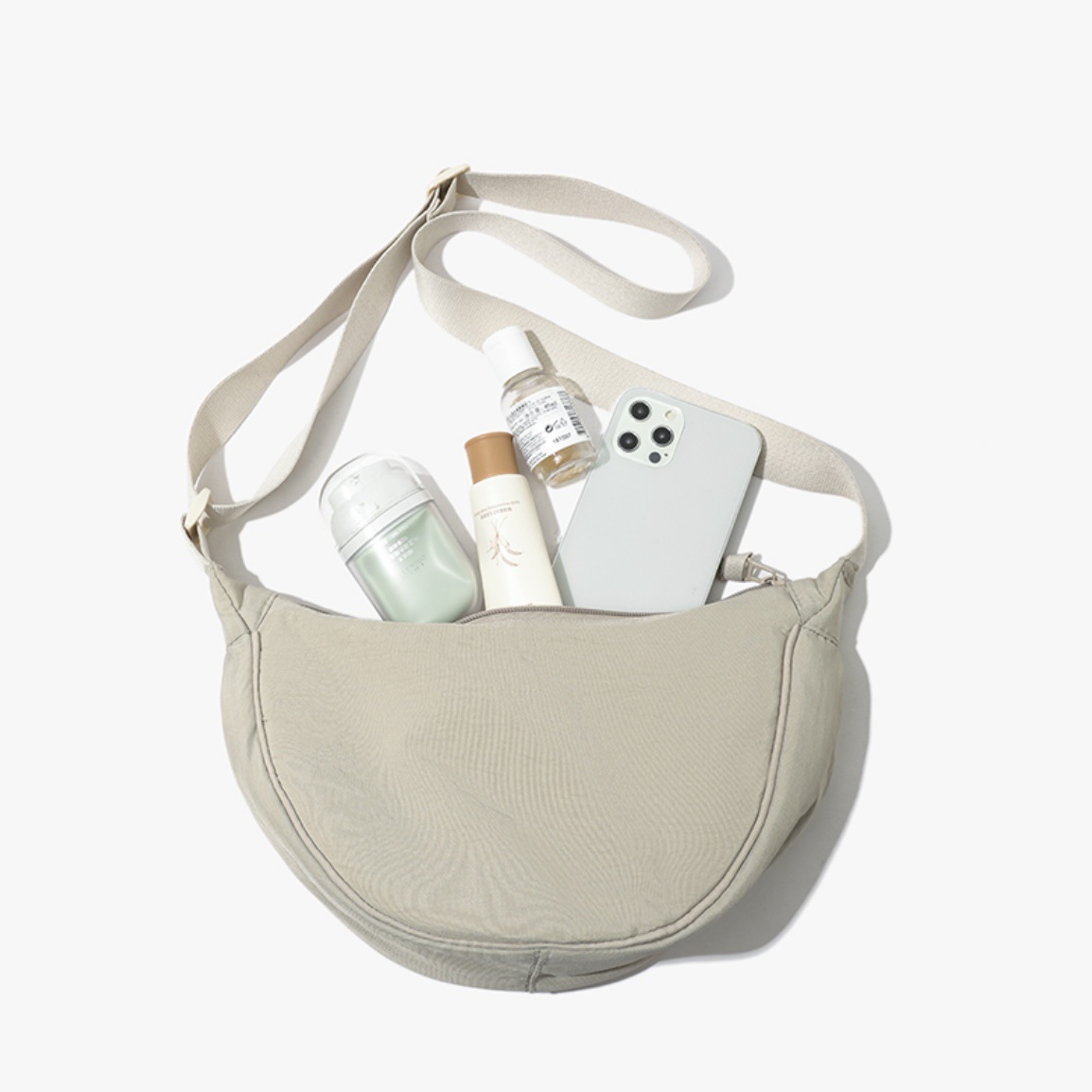 Beige Lightweight Nylon Crossbody Bag – Compact Saddle Style with Adjustable Strap for Everyday Use - Image 1