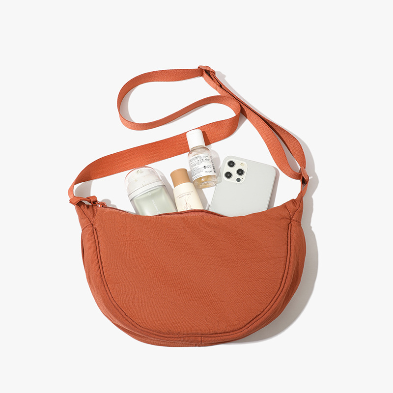 Orange Lightweight Nylon Crossbody Bag – Compact Saddle Style with Adjustable Strap for Everyday Use - Image 1