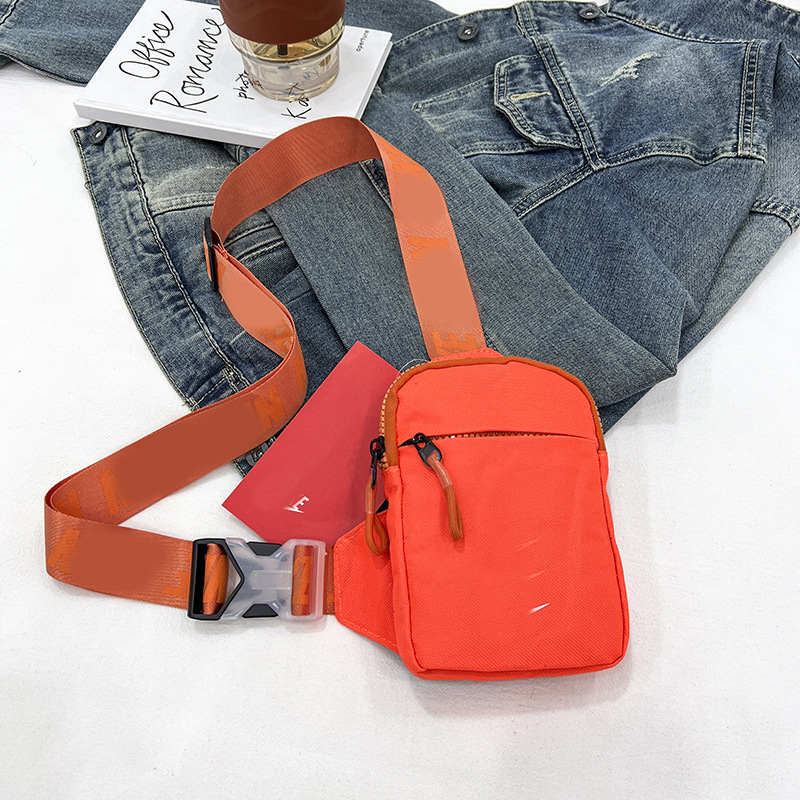 Unisex Mini Nylon Crossbody Sling Bag Chest Pouch Adjustable Wide Strap Lightweight Orange for Travel Sports & Festivals - Image 1