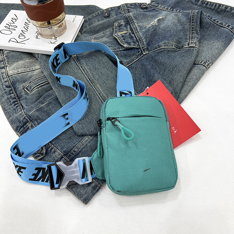 Unisex Mini Nylon Crossbody Sling Bag Chest Pouch Adjustable Wide Strap Lightweight Dark Green for Travel Sports & Festivals - Image 1