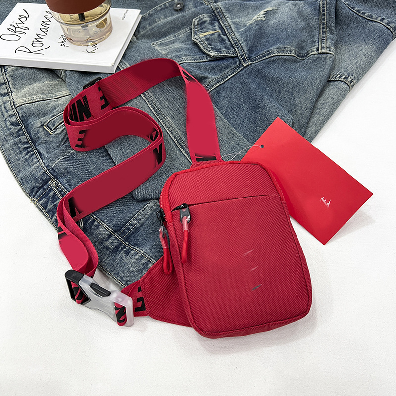 Unisex Mini Nylon Crossbody Sling Bag Chest Pouch Adjustable Wide Strap Lightweight Red for Travel Sports & Festivals - Image 1