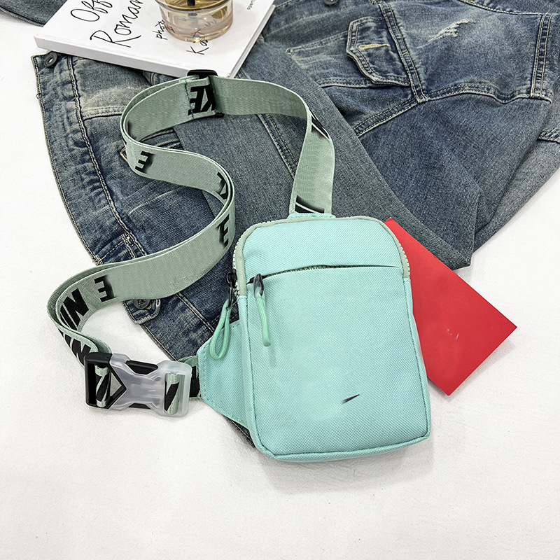 Unisex Mini Nylon Crossbody Sling Bag Chest Pouch Adjustable Wide Strap Lightweight Light Green for Travel Sports & Festivals - Image 1
