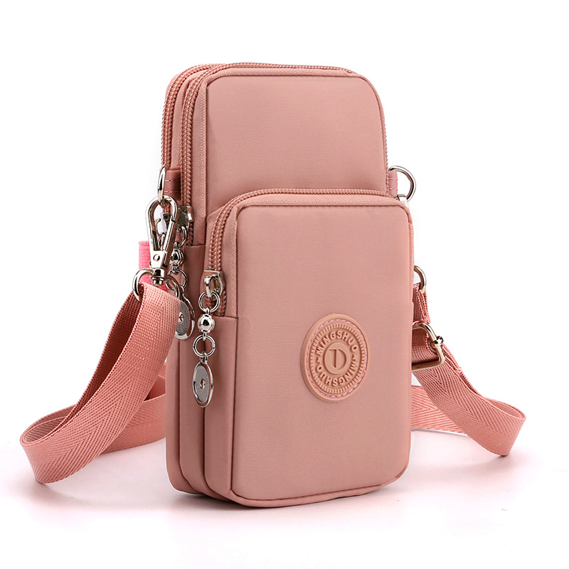 Pink 3-Layer Waterproof Nylon Vertical Crossbody Phone Bag -  Lightweight Phone Purse with Headphone Jack & Adjustable Strap - Image 1