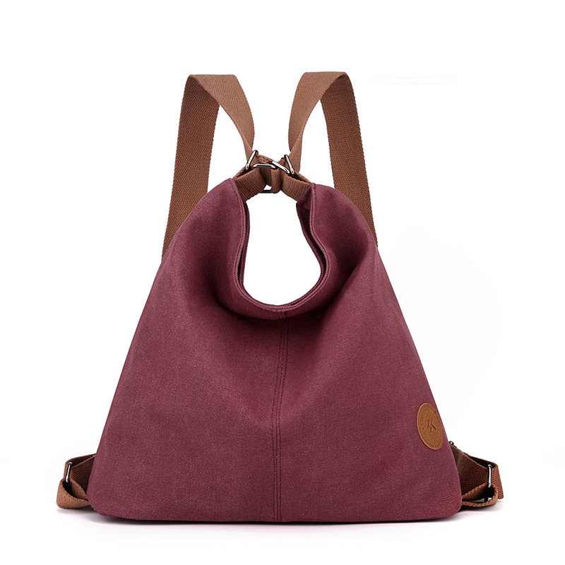 Purple Versatile 3-in-1 Canvas Backpack and Shoulder Bag Large Capacity Handbag for Women Ideal for Travel School and Everyday Use - Image 1