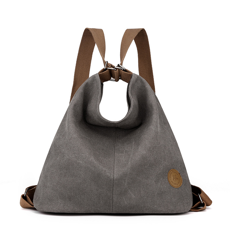 Grey Versatile 3-in-1 Canvas Backpack and Shoulder Bag Large Capacity Handbag for Women Ideal for Travel School and Everyday Use - Image 1