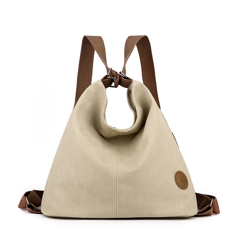 Khaki Versatile 3-in-1 Canvas Backpack and Shoulder Bag Large Capacity Handbag for Women Ideal for Travel School and Everyday Use - Image 1
