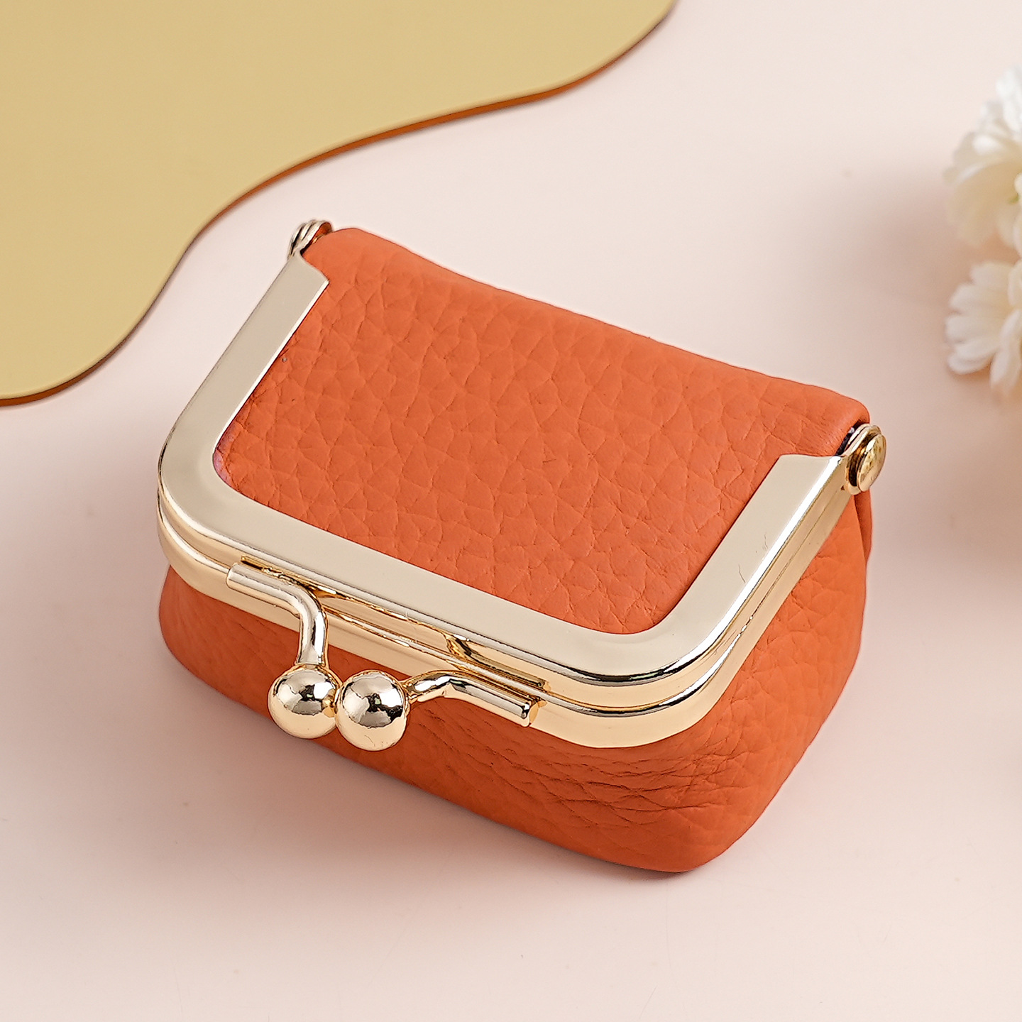Orange Genuine Leather Mini Kiss-Lock Jewelry Pouch - Portable Travel Organizer for Rings, Earrings, Necklaces, and Coins - Image 1