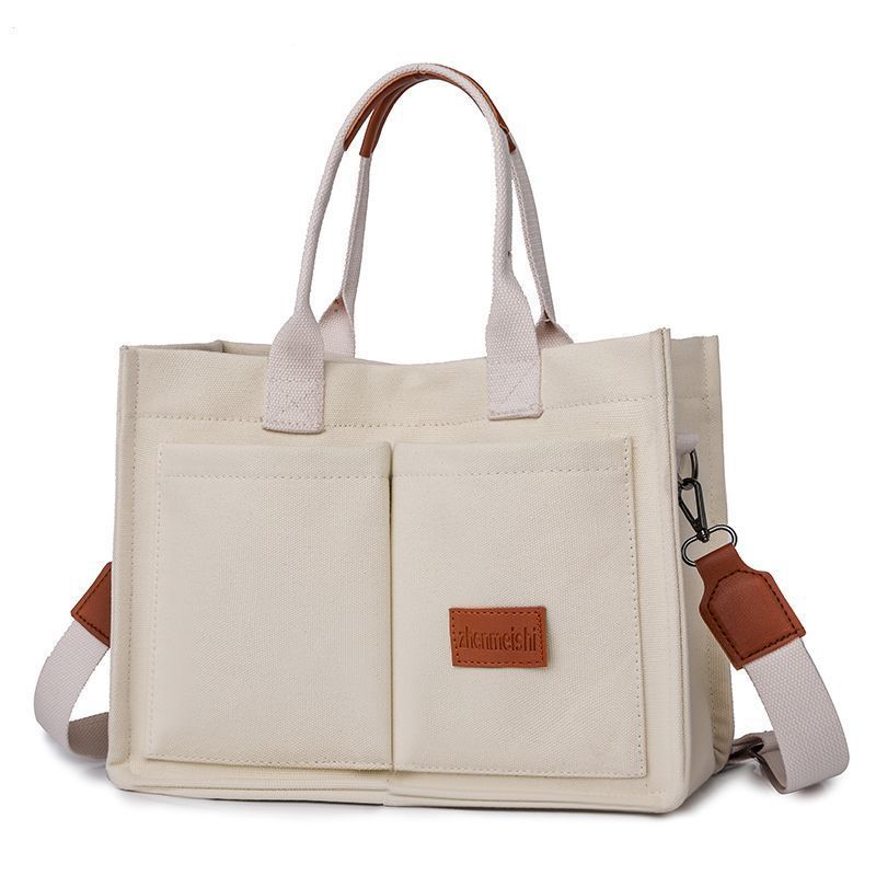 Beige Large Canvas Tote Bag for Women - Multi-Pocket Utility Organiser with Wide Adjustable Shoulder Strap - Trendy Crossbody and Handheld Bag for Work, Shopping and Travel - Daily Comfort Solution - Image 1
