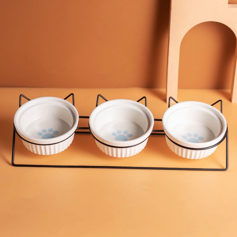 Triple Slanted Ceramic Pet Bowl Set with Elevated Iron Stand and Non Slip Base - 3 x 300ML Versatile Blue Cat Paw Print Pattern Dishes for Water & Food - Image 1