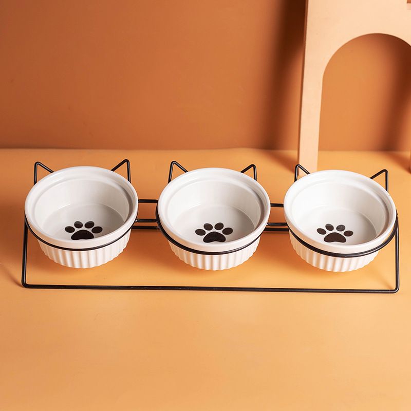 Triple Slanted Ceramic Pet Bowl Set with Elevated Iron Stand and Non Slip Base - 3 x 300ML Versatile Black Cat Paw Print Pattern Dishes for Water & Food - Image 1