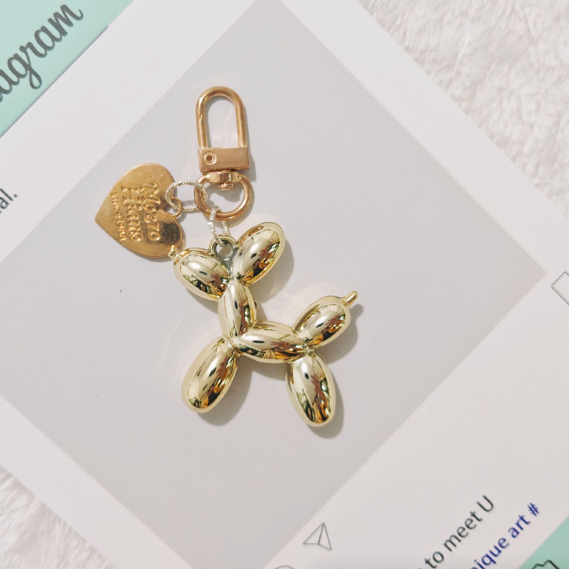 2-Piece Golden Balloon Dog Keychain Set with Heart Charm Bag Pendant Cute Couple Gift - Image 1